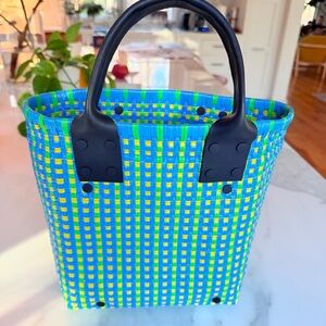 Vibrant Blue and Green top handle Truss micro Tote Bag with leather details.